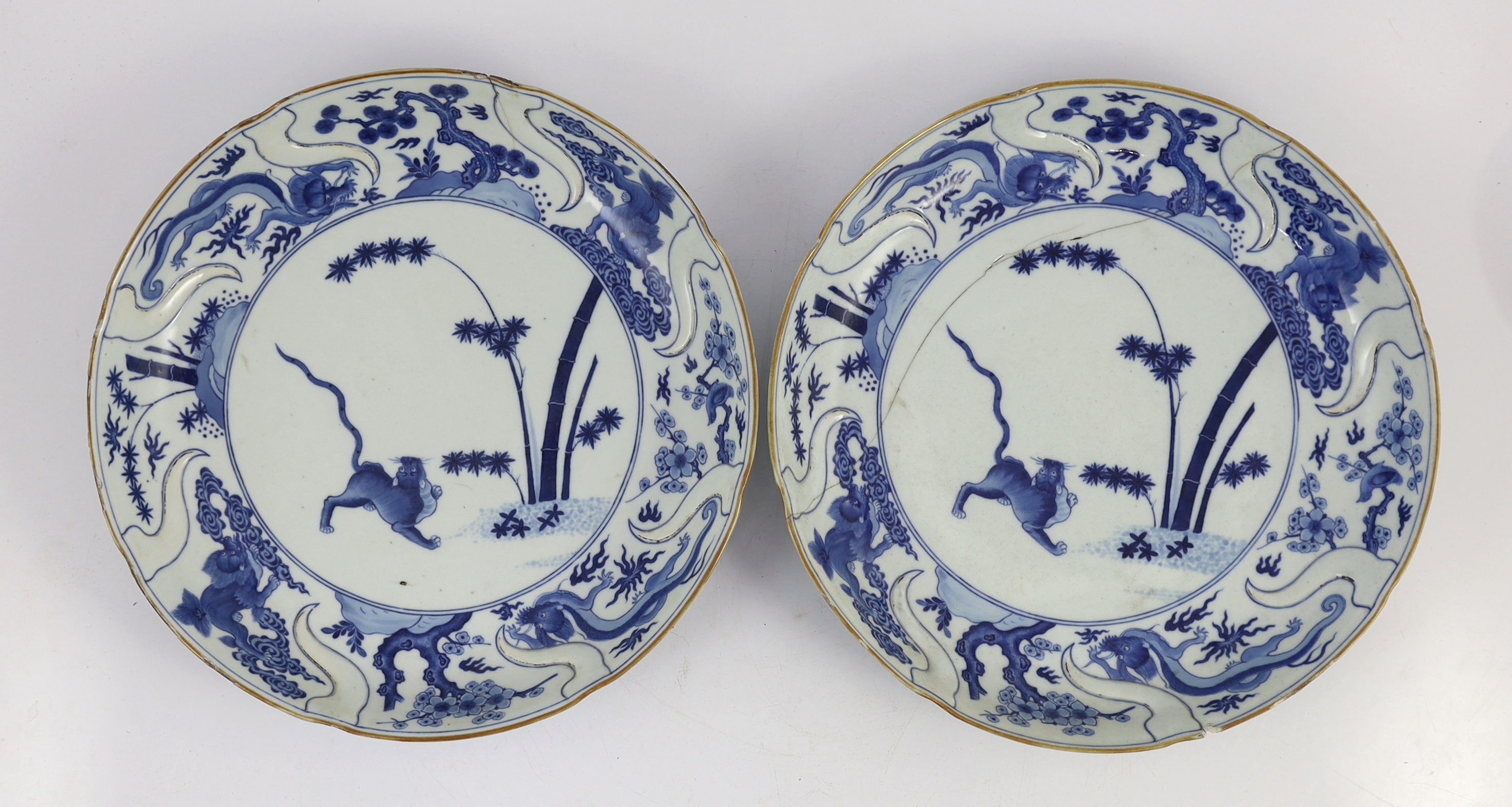 A pair of Chinese blue and white armorial dishes in Japanese Kakiemon style, Qianlong period, c.1752